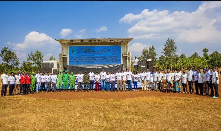 Community members and Hope Iwacu Initiative staff gathered at an outreach event in Rwanda