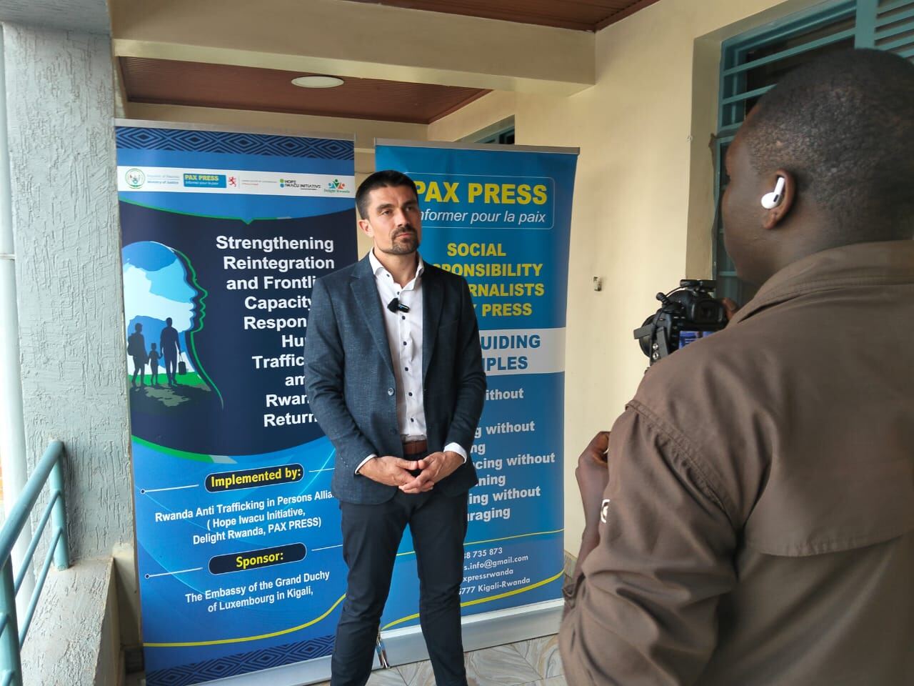 Hope Iwacu Initiative representative speaking to press at a partner event