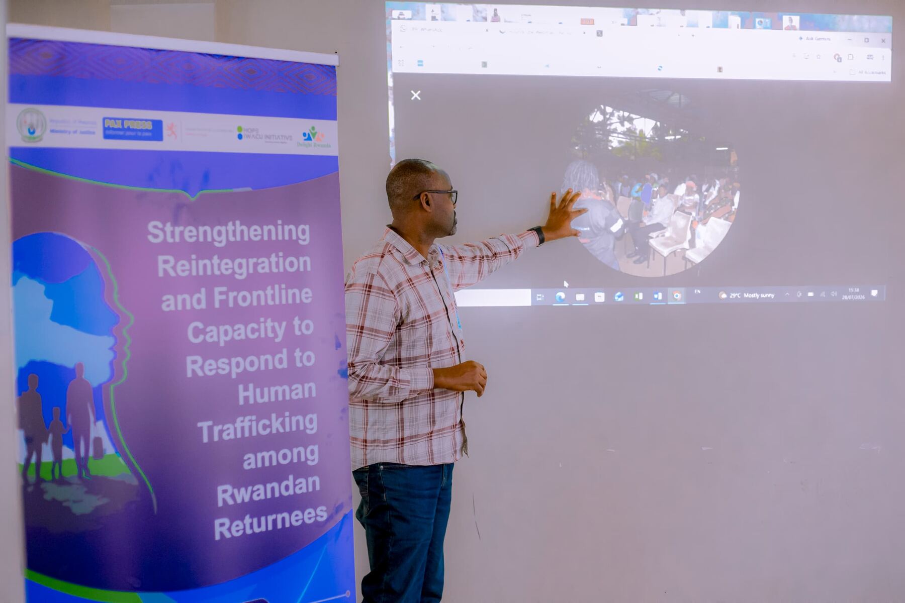 Hope Iwacu Initiative staff presenting on strengthening reintegration and frontline capacity